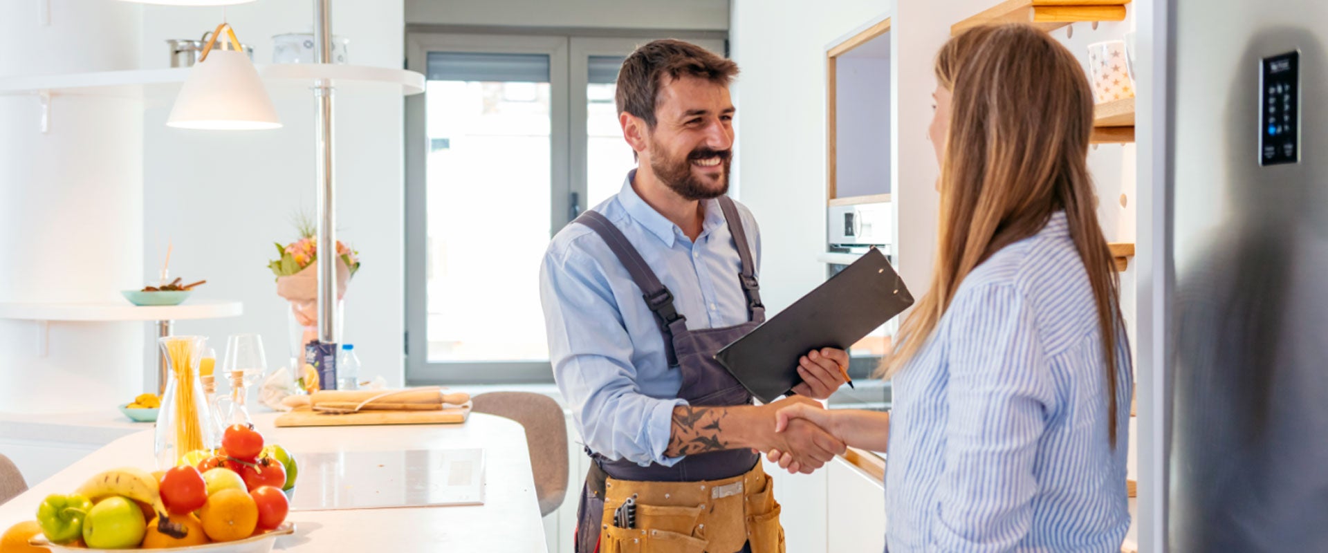 smiling contractor shaking hands with client