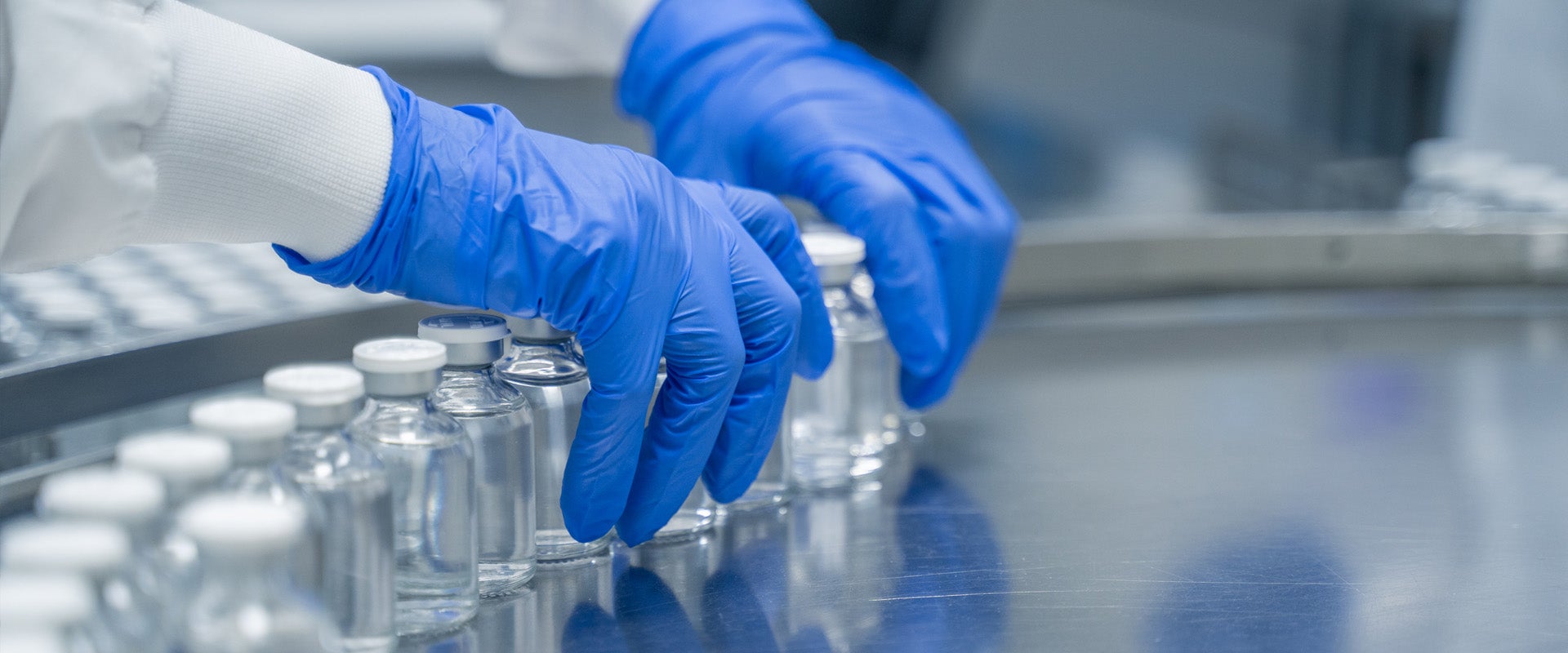 technician setting up bottles for filling