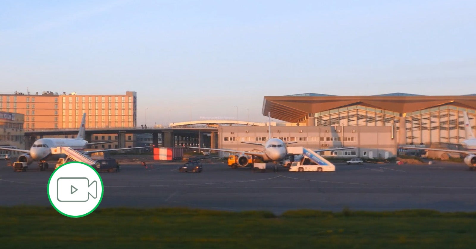 airplanes sitting at their gates on the tarmac