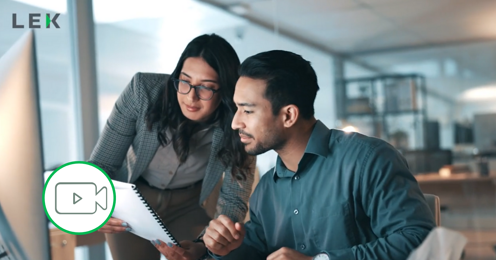 two coworkers reviewing report